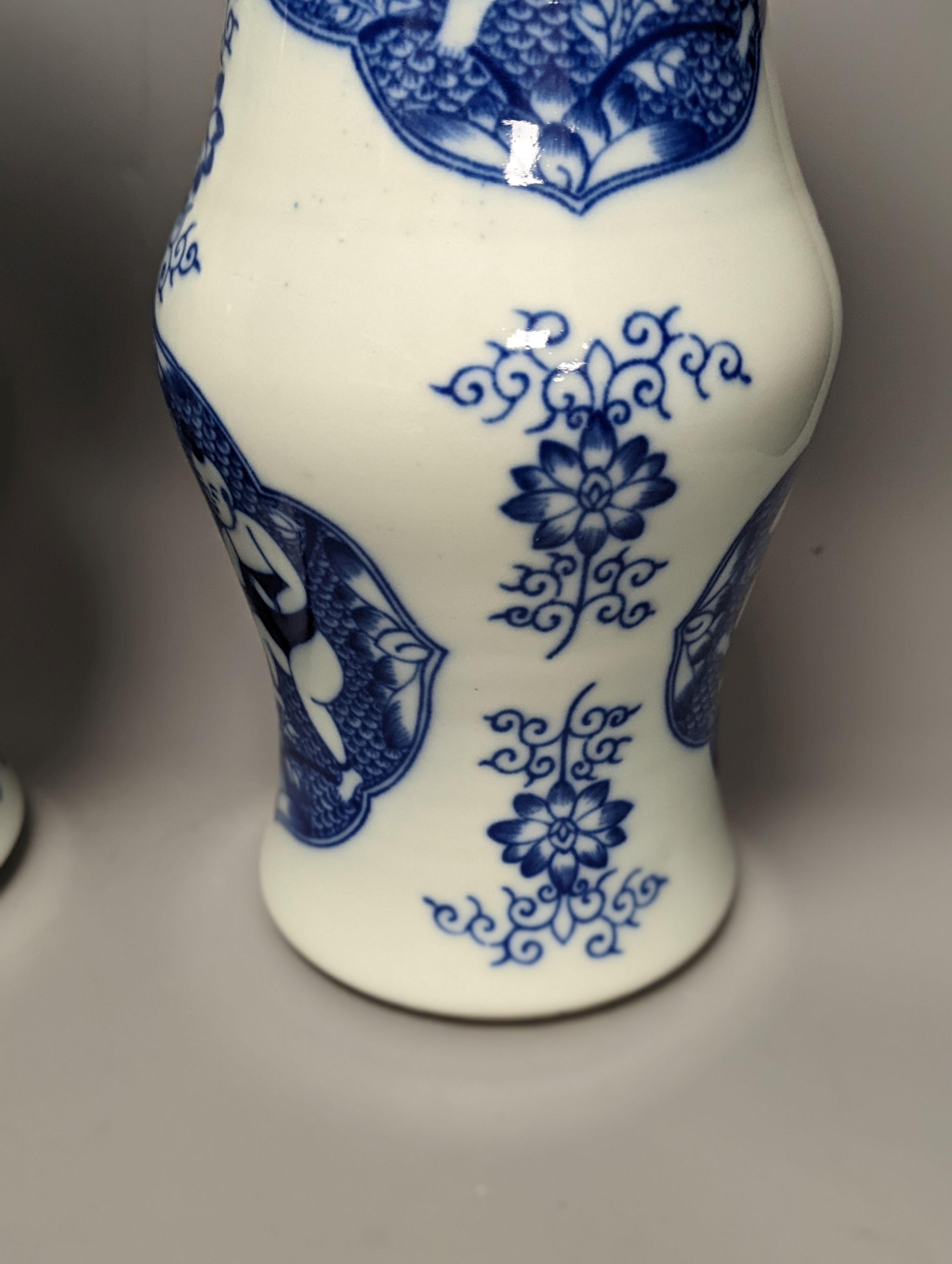A pair of Chinese blue and white vases on stands and 6 further wood stands. Vases 35cm
